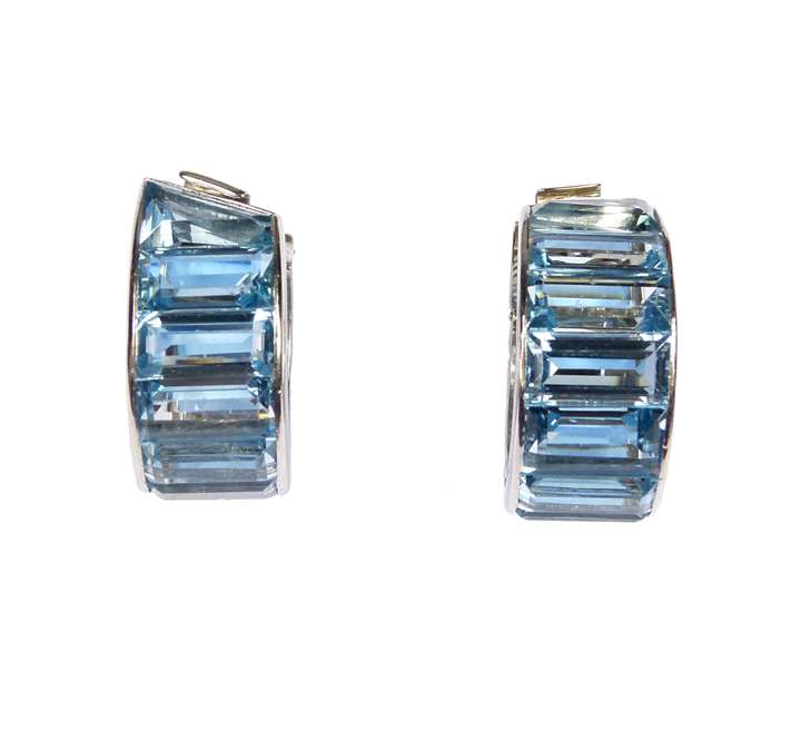 Pair of aquamarine channel set hoop earrings